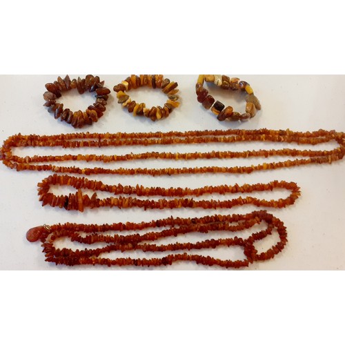 88 - Mixed vintage amber effect costume jewellery to include necklaces, one having a teardrop pendant on ... 