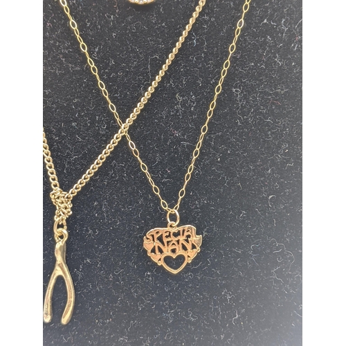 53 - **THIS LOT HAS BEEN WITHDRAWN**
Two yellow metal pendants, a 9ct gold necklace, along with a 14ct go... 