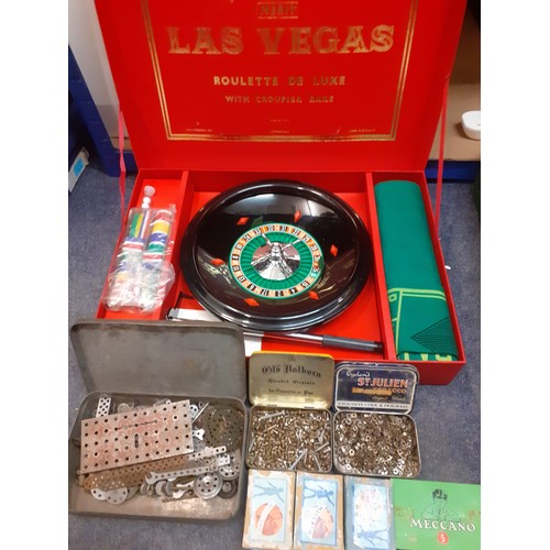 106 - A small quantity of vintage toys to include a Las Vegas roulette set and vintage Meccano small acces... 