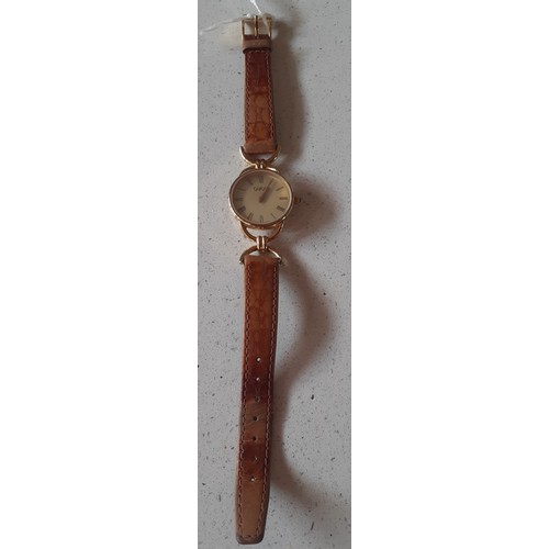 32 - Gucci- A 1990's ladies gold plated 6000.2.L watch with original mid brown Gucci leather strap. Locat... 