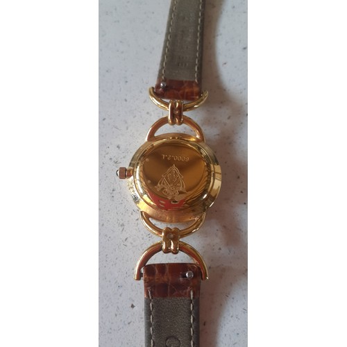 32 - Gucci- A 1990's ladies gold plated 6000.2.L watch with original mid brown Gucci leather strap. Locat... 