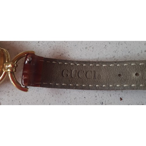 32 - Gucci- A 1990's ladies gold plated 6000.2.L watch with original mid brown Gucci leather strap. Locat... 