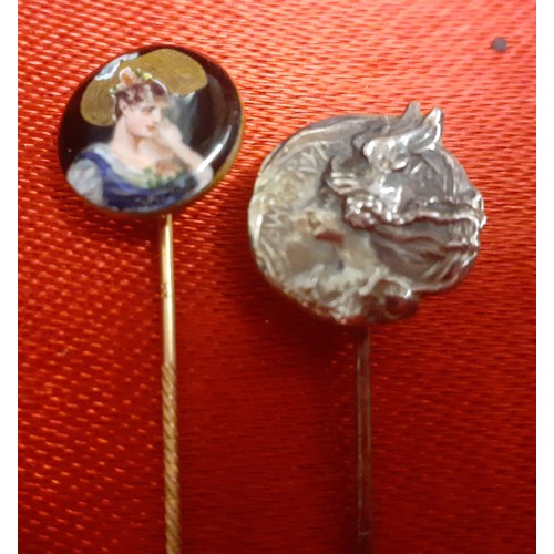 57 - A small quantity of vintage costume jewellery to include a gold tone stick pin with enamelled head h... 