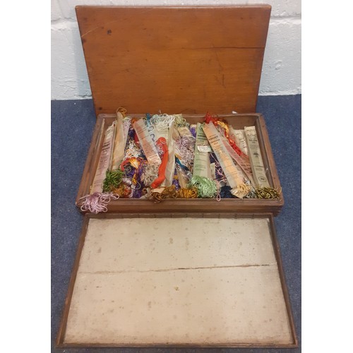 77 - An early 20th Century mahogany box containing a quantity of Briggs Court embroidery silks, C.A Ricka... 