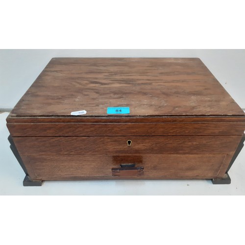 84 - An Art Deco oak jewellery box having one drawer and hinged lid, both lined in velvet, 45cm wide x 29... 