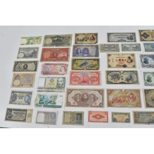 113 - Banknotes - A collection of 19th Century and later banknotes from around the world to include, Georg... 