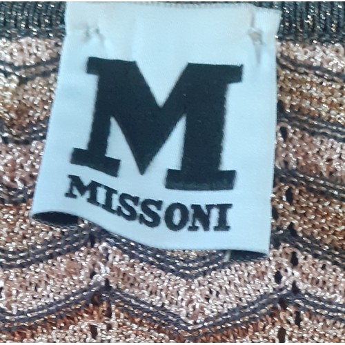 7 - Missoni-A modern knee length dress in gold, salmon pink and grey having a zig zag pattern with a gli... 