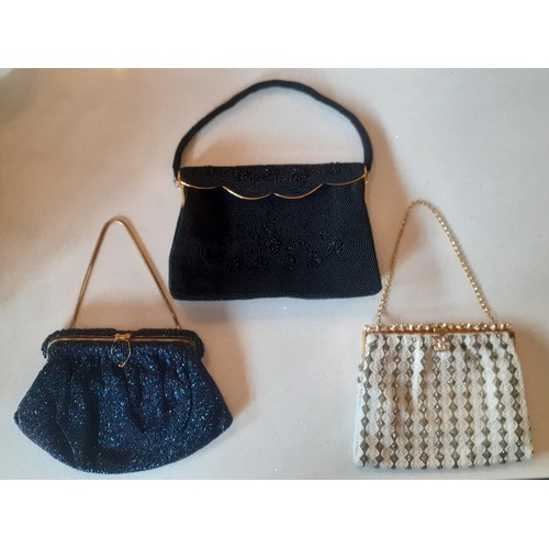 93 - Three mid 20th Century French fine bead evening bags in navy, black and cream all having gold tone h... 