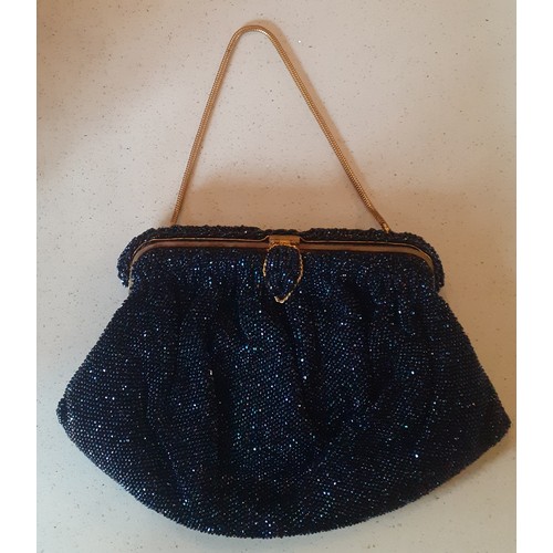 93 - Three mid 20th Century French fine bead evening bags in navy, black and cream all having gold tone h... 