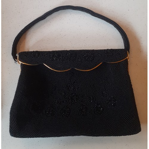 93 - Three mid 20th Century French fine bead evening bags in navy, black and cream all having gold tone h... 