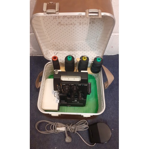 99 - A Husqvana Huskylock 530 sewing machine with case and accessories (plug requires adaptor for the UK ... 