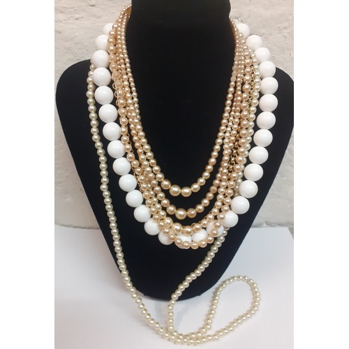 100 - A large quantity of modern costume jewellery to include bangles, bead necklaces and faux pearls. Loc... 