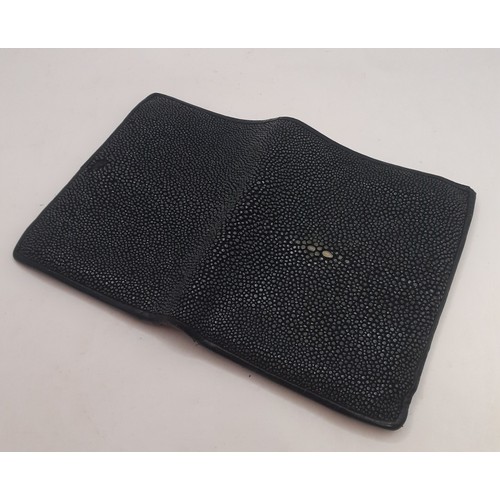 48 - A black polished stingray skin wallet with black leather interior. Location: BWR
If there is no cond... 