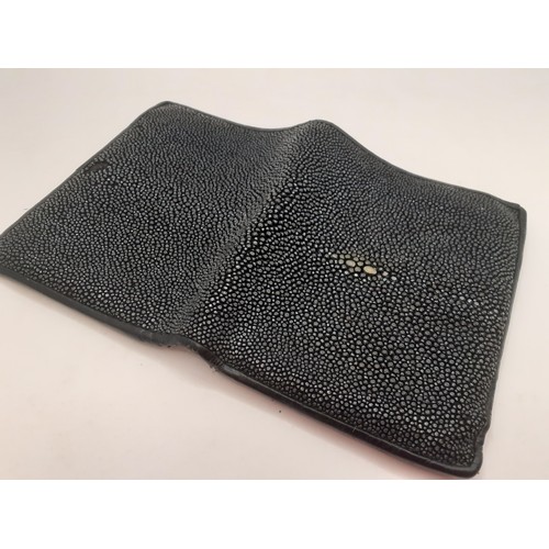 48 - A black polished stingray skin wallet with black leather interior. Location: BWR
If there is no cond... 