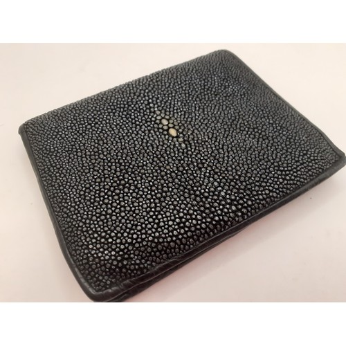 48 - A black polished stingray skin wallet with black leather interior. Location: BWR
If there is no cond... 