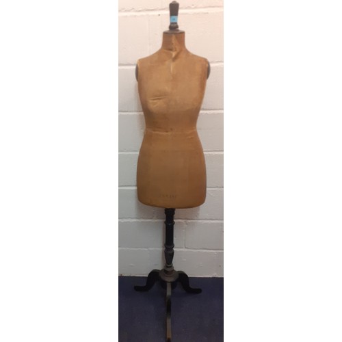 26 - A vintage Levine tailors dummy A/F having brown cloth body on a black lacquered adjustable frame, mi... 