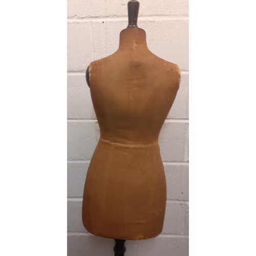 26 - A vintage Levine tailors dummy A/F having brown cloth body on a black lacquered adjustable frame, mi... 