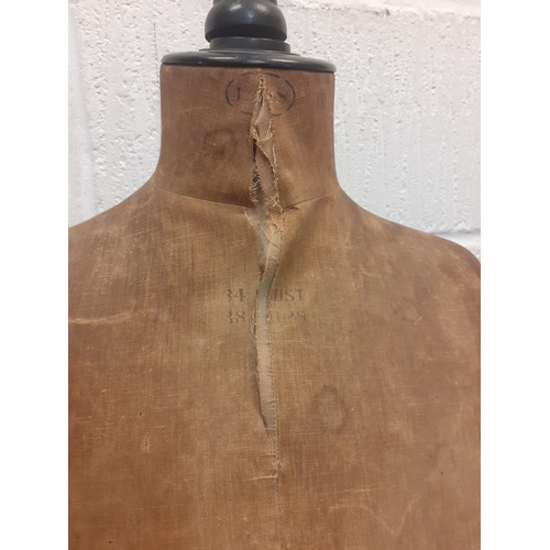 26 - A vintage Levine tailors dummy A/F having brown cloth body on a black lacquered adjustable frame, mi... 