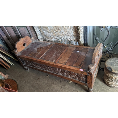 182 - A South Asian carved hardwood bench with a box base, on turned legs, 59cm h x 120cm w
Location: BCon... 