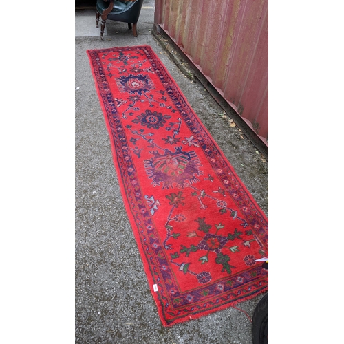 192 - A Turkish runner with geometric motifs on a red ground, 360cm h x 95cm w
Location: BB
If there is no... 