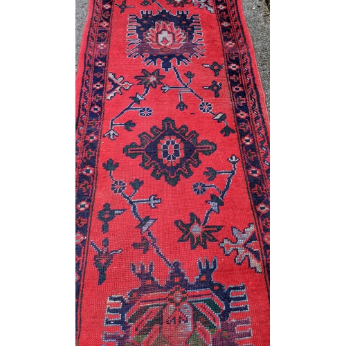 192 - A Turkish runner with geometric motifs on a red ground, 360cm h x 95cm w
Location: BB
If there is no... 