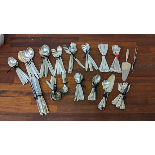 20 - WMF cutlery and flatware to include 9 knives, 7 dessert spoons, 8 soup spoons, 6 table forks, 6 side... 