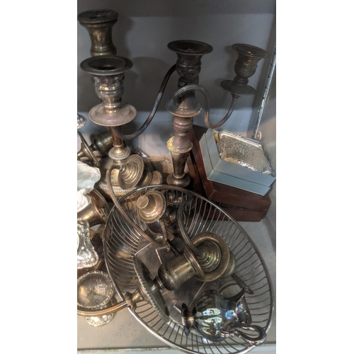 390 - A mixed lot to include silver plated candlesticks, silver pin dish, silver topped shakers, coins and... 