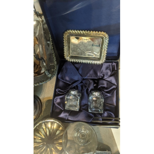 390 - A mixed lot to include silver plated candlesticks, silver pin dish, silver topped shakers, coins and... 