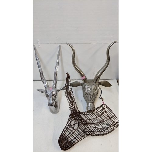 418 - A cast metal gazelle head, a wire goats head and metal animal light head
Location: G
If there is no ... 