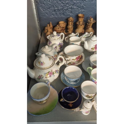 68 - Mixed ceramics to include a quantity of miniature teapots, cups and saucers and others to include Ro... 