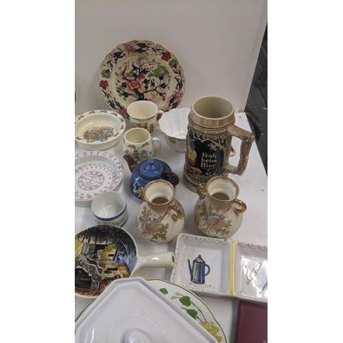 78 - A large quantity of mixed ceramics to include commemorative examples, two steins, Royal Doulton, Mas... 