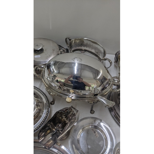 81 - Silver plated items to include a revolving lid breakfast dish with serving ladle, a meat cloche, a t... 