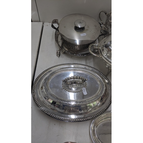 81 - Silver plated items to include a revolving lid breakfast dish with serving ladle, a meat cloche, a t... 