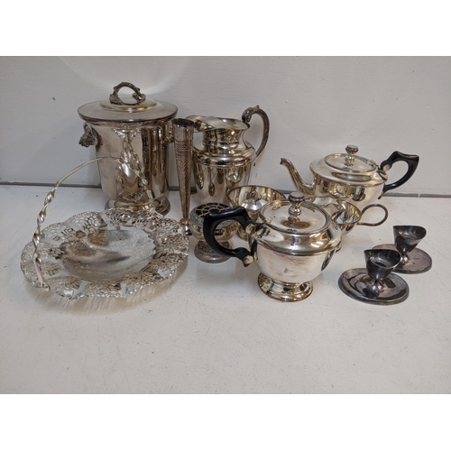 1 - Mixed silver plated items to include an ice bucket, 2 teapots, jug, a pair of candlestick holders, a... 