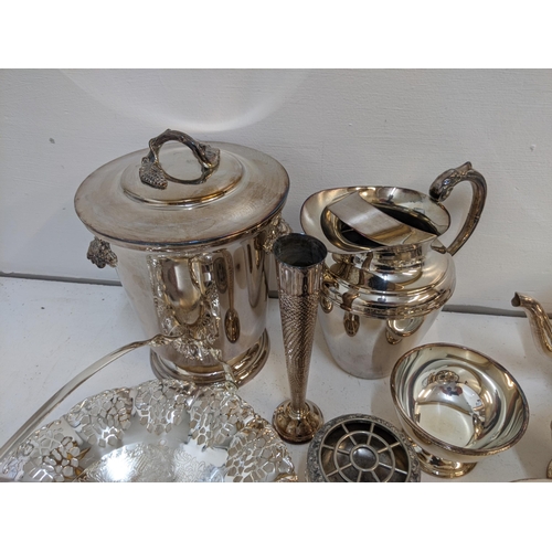 1 - Mixed silver plated items to include an ice bucket, 2 teapots, jug, a pair of candlestick holders, a... 