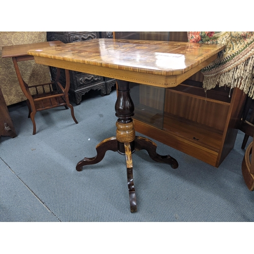 12 - A mid 19th century Italian side table with a marquetry top decorated with three flowers on a decorat... 