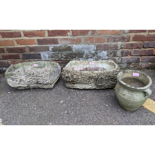 131 - Two weathered Cotstone garden planters, textured design to exterior, and a weathered pottery twin ha... 