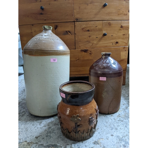 132 - Two stoneware brewery flagon jars and a pottery vase, the flagons advertising J S Smith & Co Phoenix... 