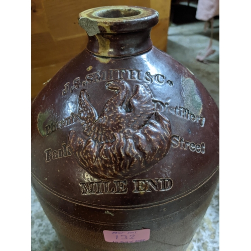 132 - Two stoneware brewery flagon jars and a pottery vase, the flagons advertising J S Smith & Co Phoenix... 