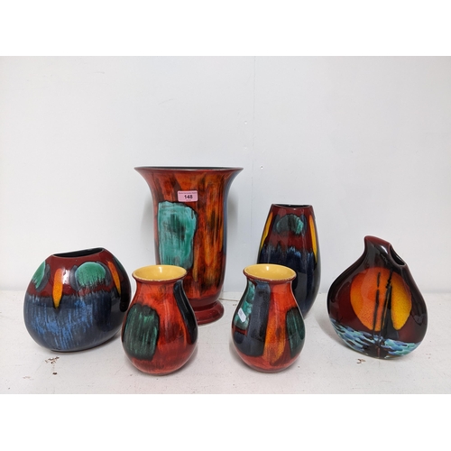 148 - A group of contemporary Poole pottery vases and an Anita Harris vase decorated with a sailing boat a... 