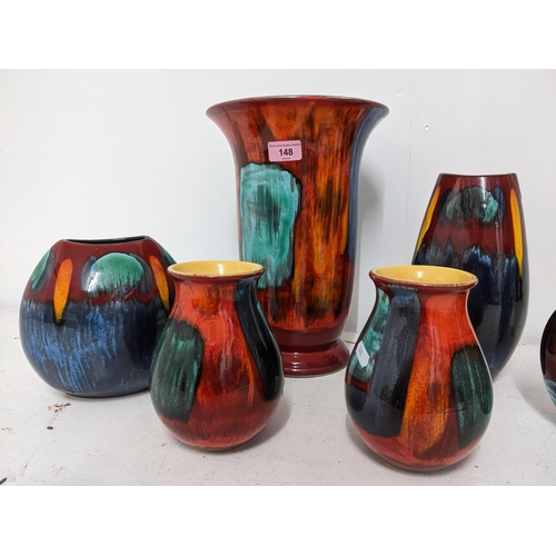 148 - A group of contemporary Poole pottery vases and an Anita Harris vase decorated with a sailing boat a... 