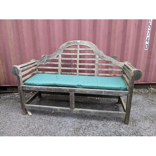 157 - A Lutyens weathered wooden slatted garden bench, with green upholstered cushion seat, with green fab... 