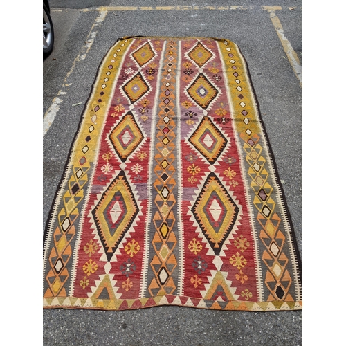 158 - A Turkish Kelim rug with horizontal bands of geometrical patterns 317cm x 152cm Location:A2M
If ther... 