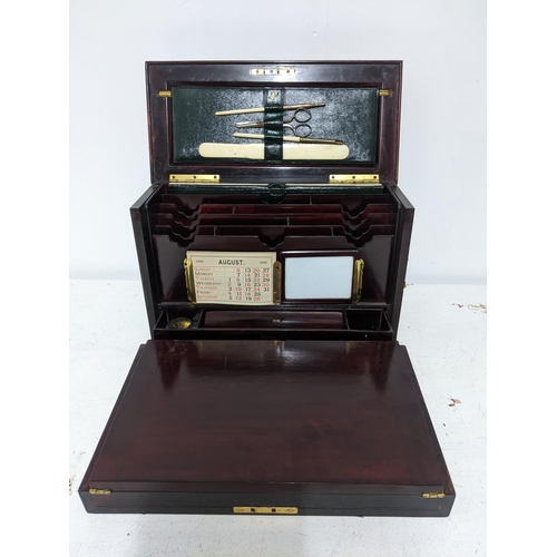 161 - A late Victorian inlaid rosewood stationery/writing box, the exterior with floral decoration and gil... 