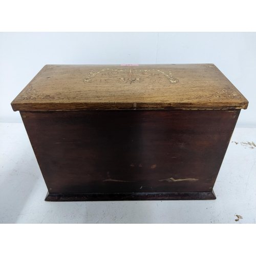 161 - A late Victorian inlaid rosewood stationery/writing box, the exterior with floral decoration and gil... 