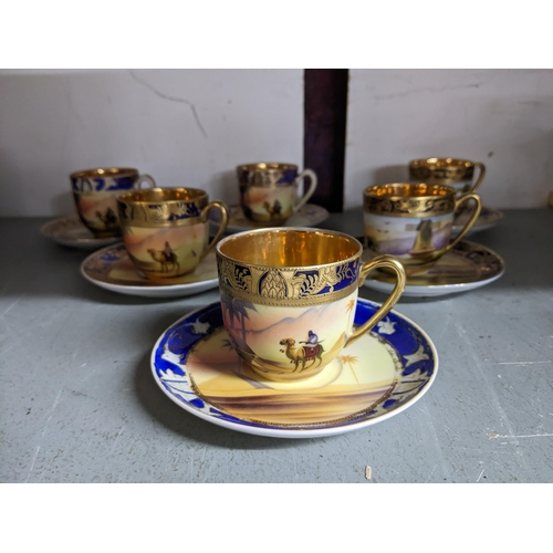 168 - An early 20th century Japanese Camel china set of six coffee cups and saucers, four decorated with a... 