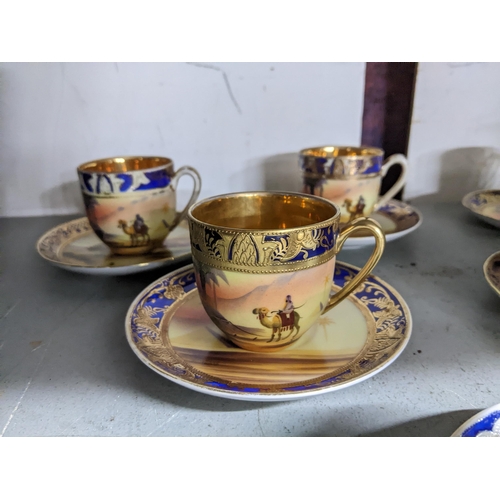 168 - An early 20th century Japanese Camel china set of six coffee cups and saucers, four decorated with a... 