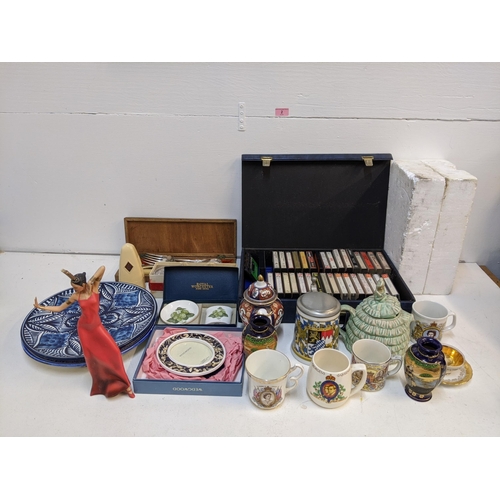 2 - A mixed lot of ceramics and china to include hanging decorative plates, a sacred art figure, some Or... 