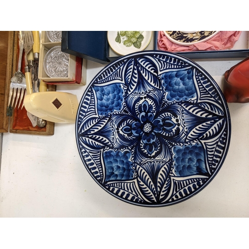 2 - A mixed lot of ceramics and china to include hanging decorative plates, a sacred art figure, some Or... 