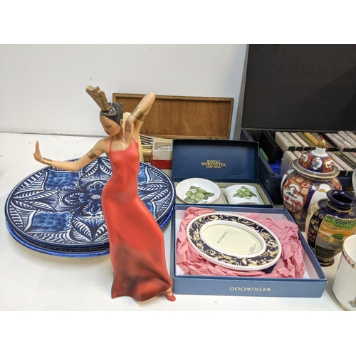 2 - A mixed lot of ceramics and china to include hanging decorative plates, a sacred art figure, some Or... 